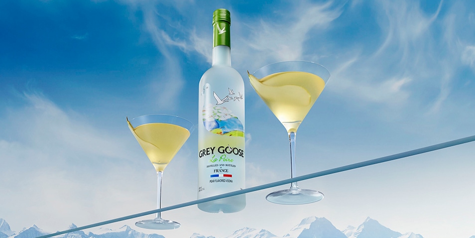 A bottle of Grey Goose La Poire and two Peartini Martini Cocktails.