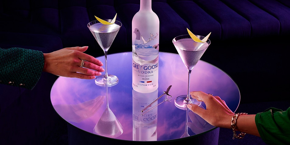How do you hold a martini cocktail glass?